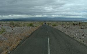 The road across Baltra, with the island of Santa Cruz looming in the distance.
